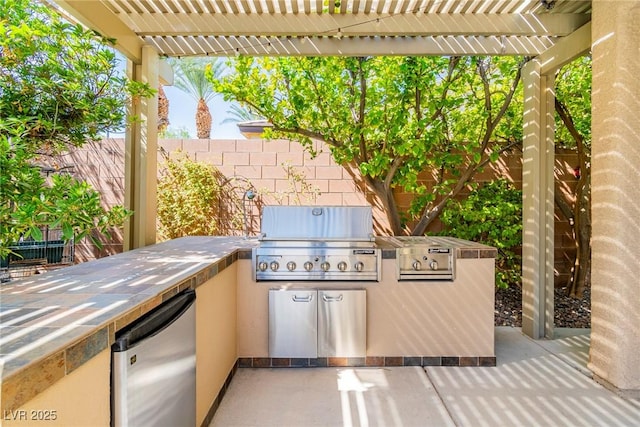 view of patio with an outdoor kitchen, a grill, and a pergola