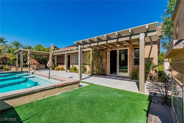 back of property featuring a lawn, a pergola, and a patio