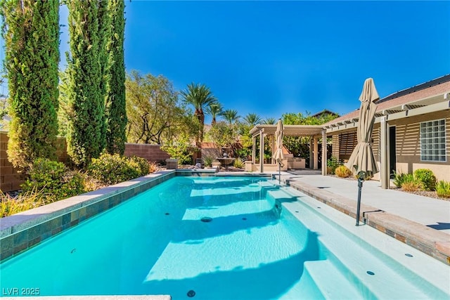 view of swimming pool with a pergola and a patio area