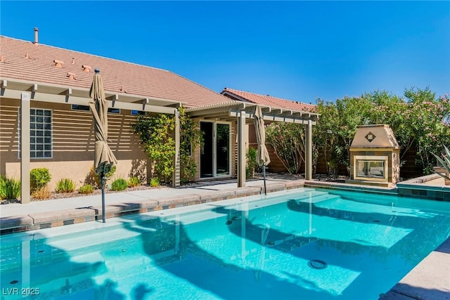 view of swimming pool featuring a pergola and a patio