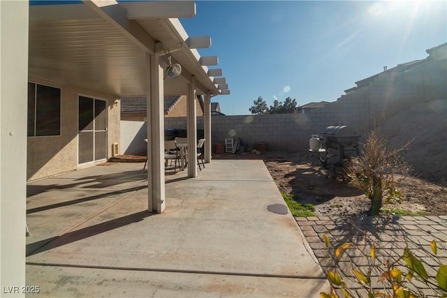 view of patio featuring a grill