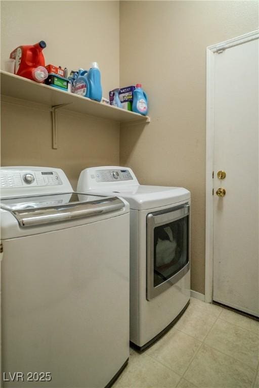 laundry room featuring washing machine and clothes dryer