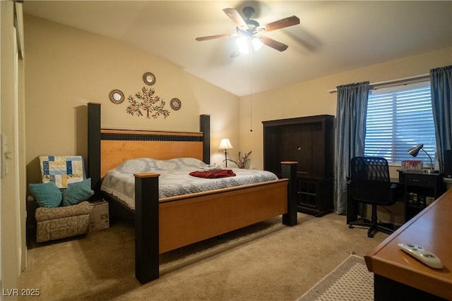 bedroom featuring vaulted ceiling, carpet floors, and ceiling fan