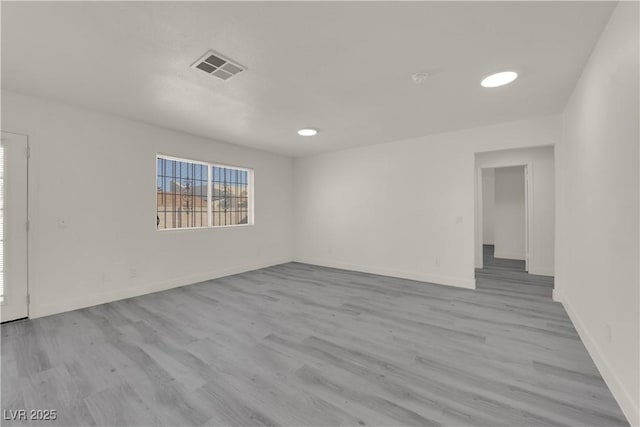 unfurnished room featuring light hardwood / wood-style flooring