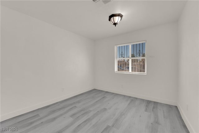 empty room featuring light hardwood / wood-style floors