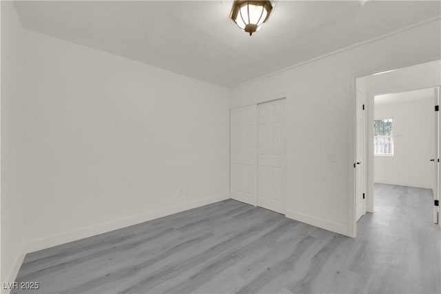 unfurnished room with light hardwood / wood-style flooring