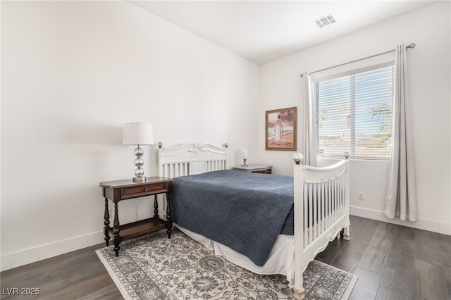 bedroom featuring dark hardwood / wood-style flooring