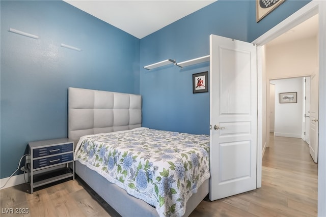 bedroom with hardwood / wood-style flooring