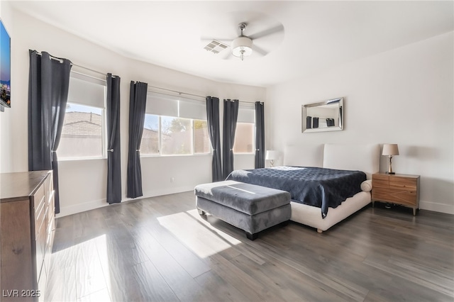 bedroom featuring ceiling fan and dark hardwood / wood-style flooring