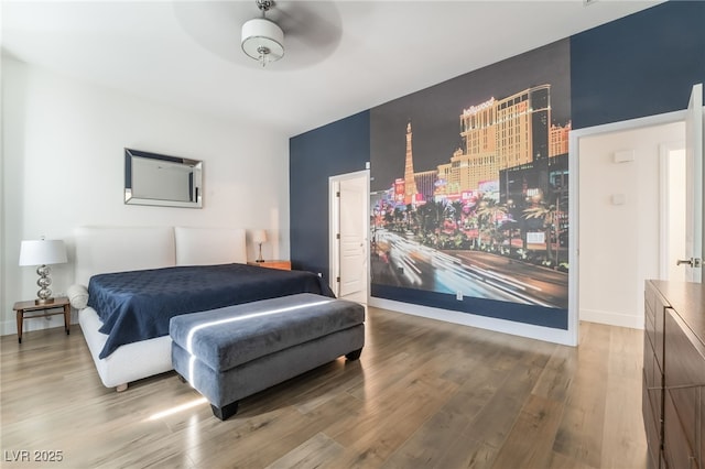 bedroom featuring ceiling fan and wood-type flooring