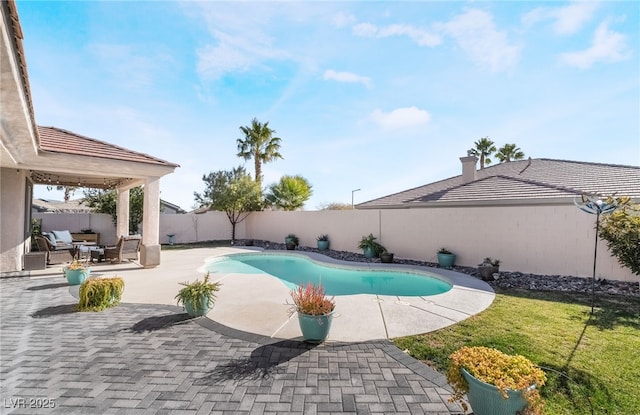 view of swimming pool featuring a patio