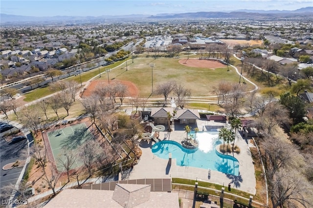 birds eye view of property with a mountain view