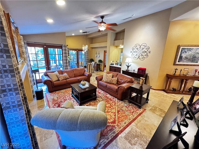 living room with ceiling fan and lofted ceiling