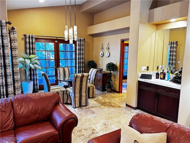 living room featuring indoor bar and french doors