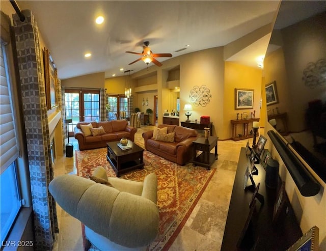 living room with ceiling fan and lofted ceiling