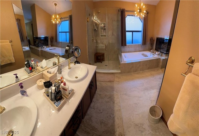 bathroom with vanity, a chandelier, and shower with separate bathtub