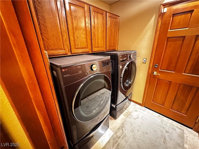 washroom with cabinets and independent washer and dryer