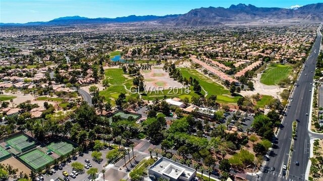 birds eye view of property with a mountain view