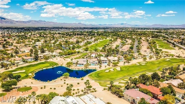 drone / aerial view with a water and mountain view