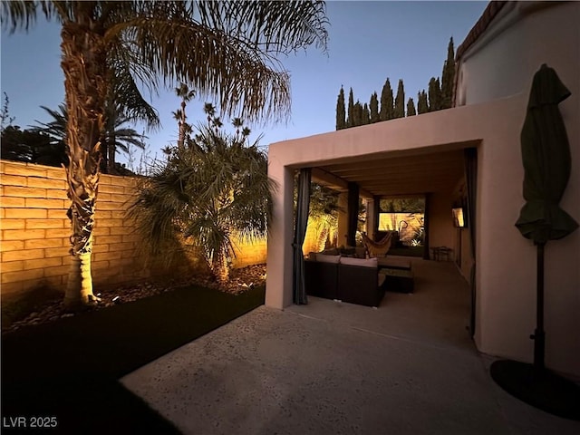 patio terrace at dusk with an outdoor hangout area