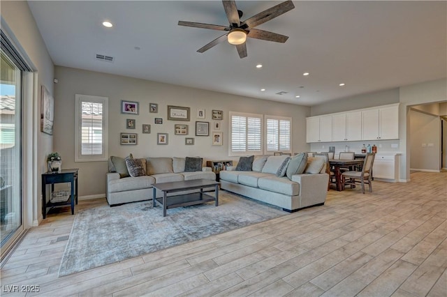 living room with light hardwood / wood-style floors and plenty of natural light