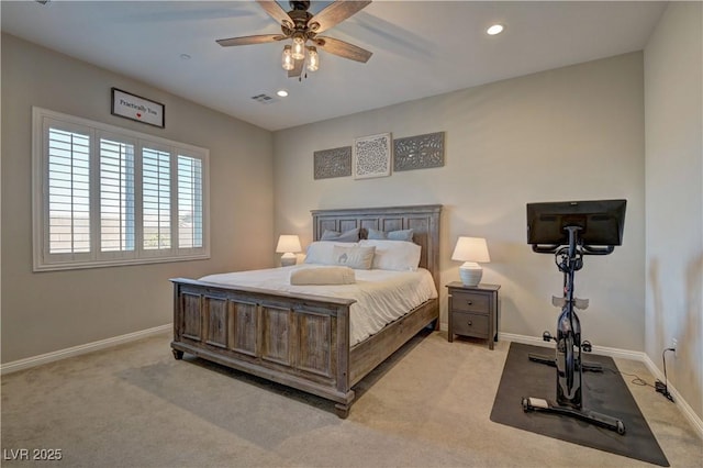 bedroom featuring ceiling fan and light colored carpet