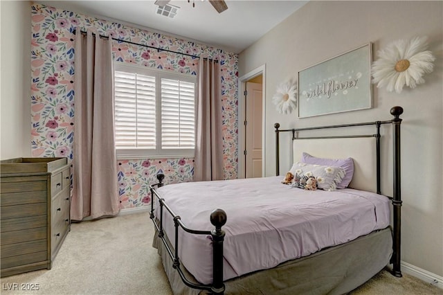 bedroom featuring ceiling fan and light carpet