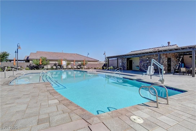 view of pool featuring a pergola and a patio