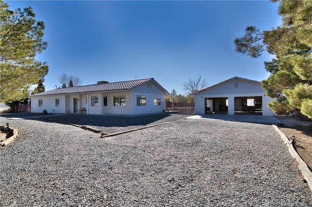 view of front facade with an outbuilding and a garage