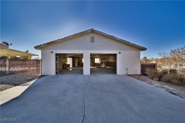 exterior space with an outbuilding and a garage