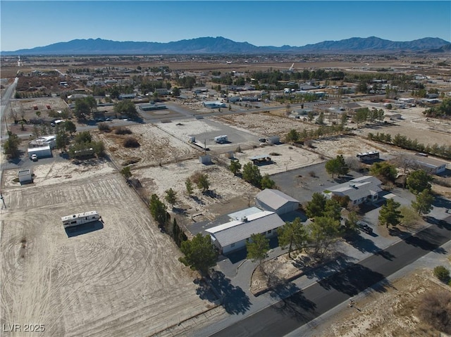 birds eye view of property featuring a mountain view