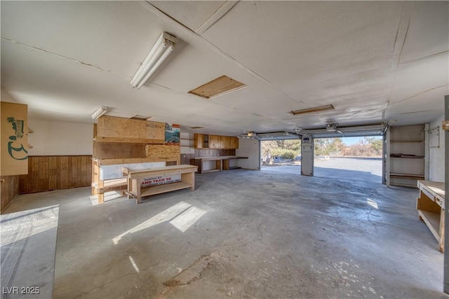 garage featuring wood walls