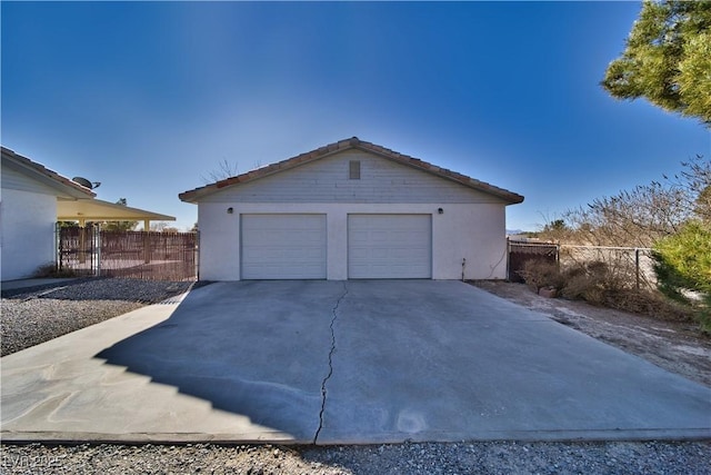 view of side of property with an outbuilding and a garage