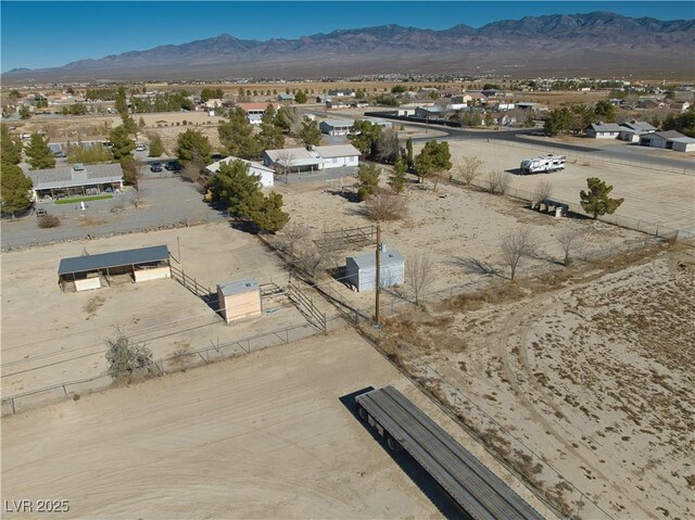 birds eye view of property featuring a mountain view