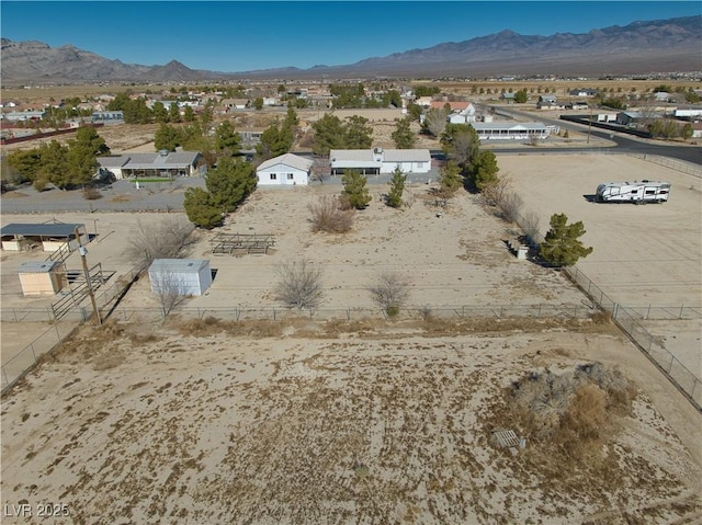 birds eye view of property with a mountain view