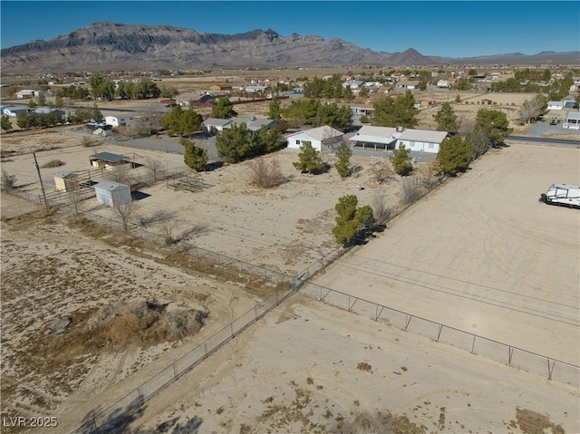 birds eye view of property with a mountain view