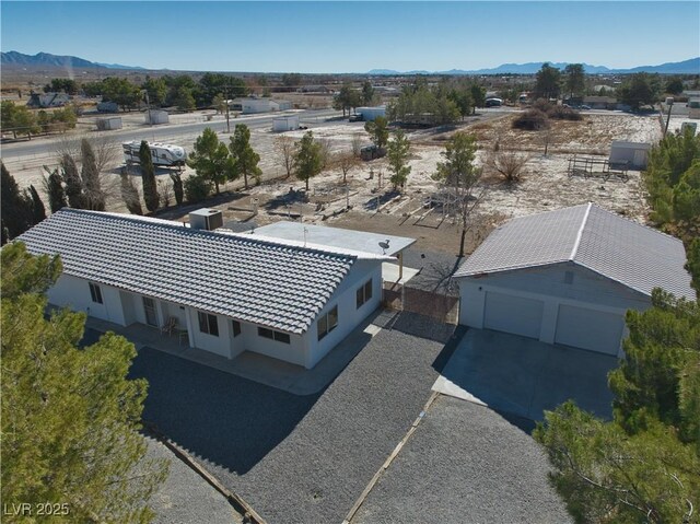 birds eye view of property with a mountain view