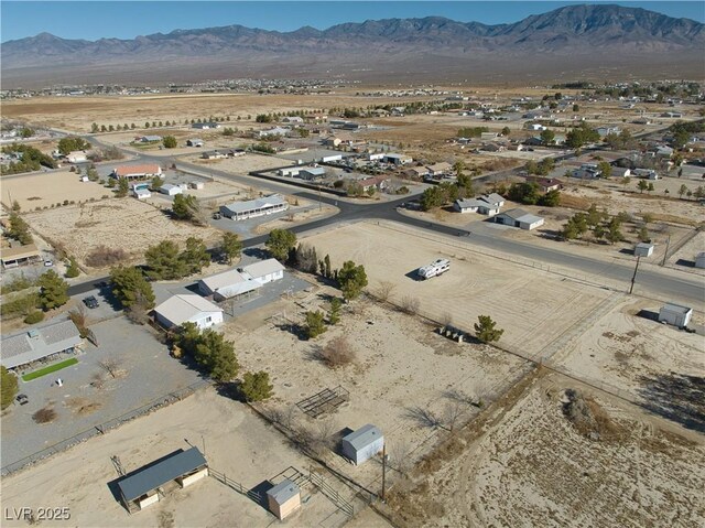 birds eye view of property featuring a mountain view