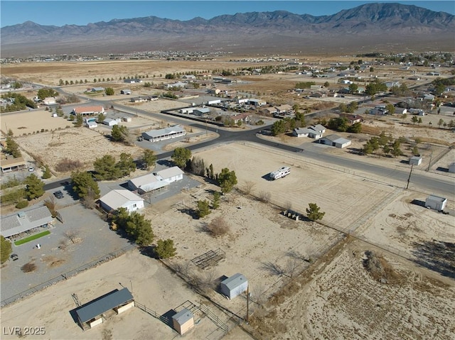 birds eye view of property featuring a mountain view