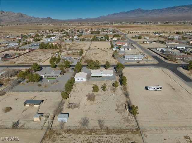 birds eye view of property featuring a mountain view