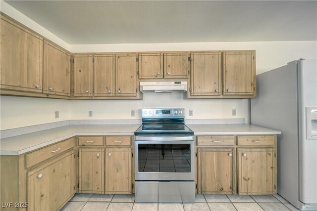 kitchen with stainless steel appliances and light tile patterned flooring