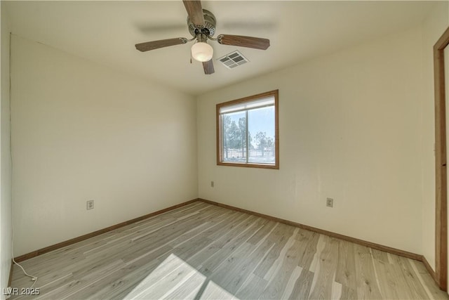 empty room with light hardwood / wood-style floors and ceiling fan