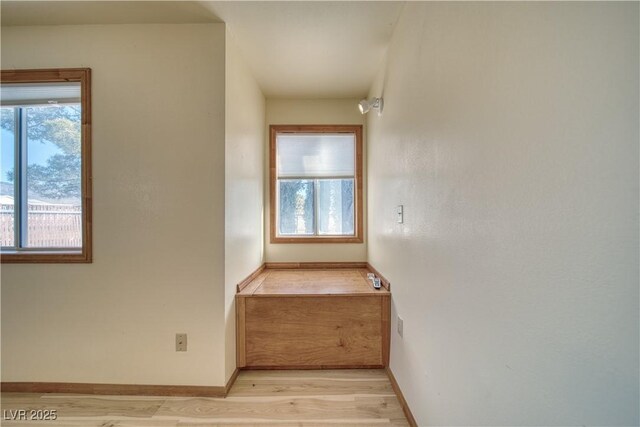 staircase featuring hardwood / wood-style flooring and a healthy amount of sunlight