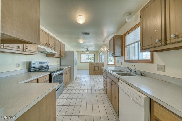 kitchen featuring dishwasher, decorative light fixtures, electric range, ceiling fan, and sink