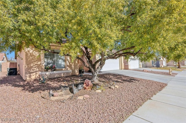 obstructed view of property with a garage