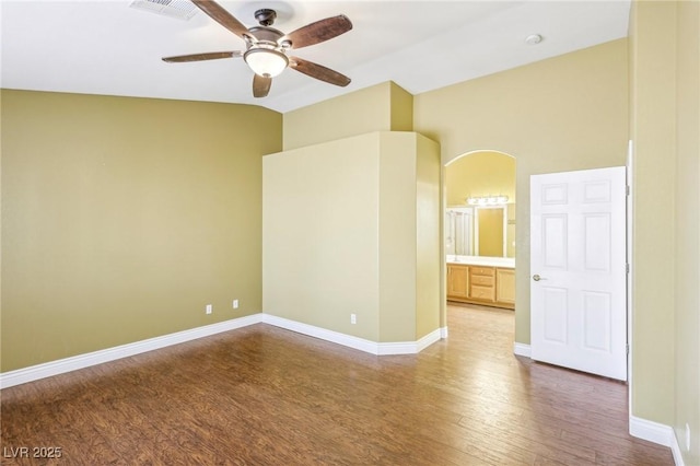 unfurnished room featuring ceiling fan, hardwood / wood-style floors, and vaulted ceiling