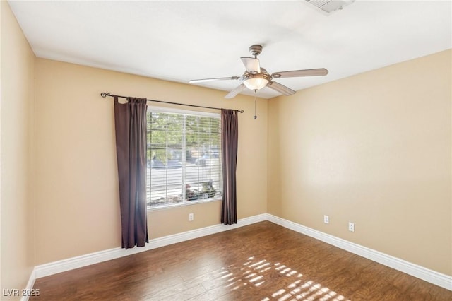 empty room featuring hardwood / wood-style flooring and ceiling fan