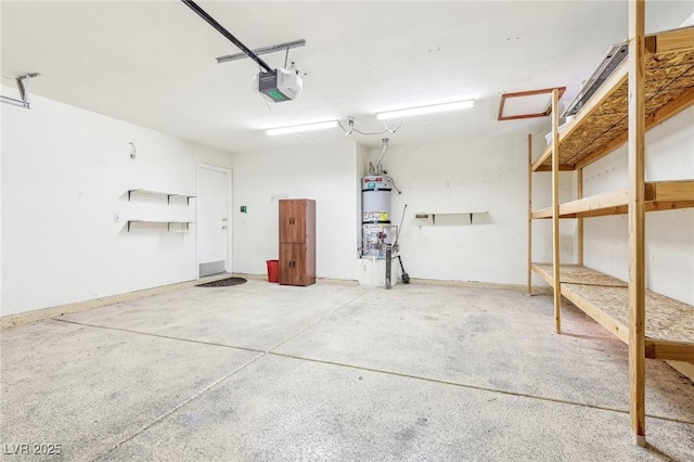 garage featuring water heater and a garage door opener