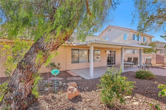 back of property with a patio area