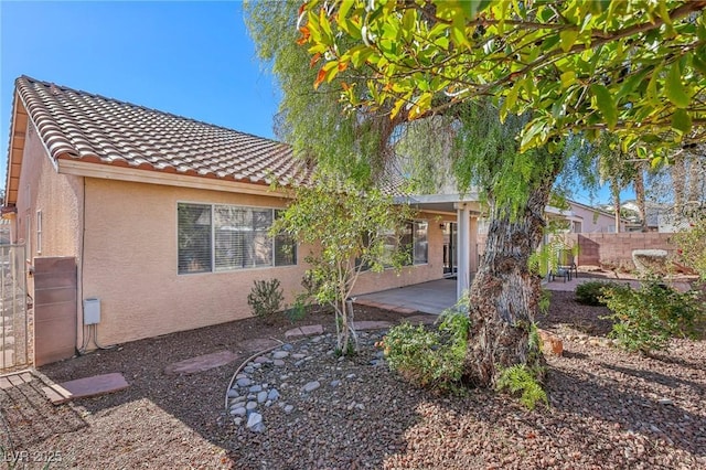 back of house with a patio